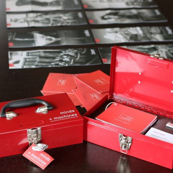Minds + Machines red press kit box