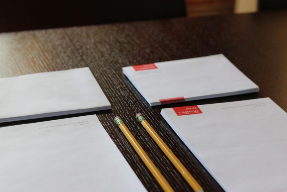 Minds + Machines letterhead with pencils