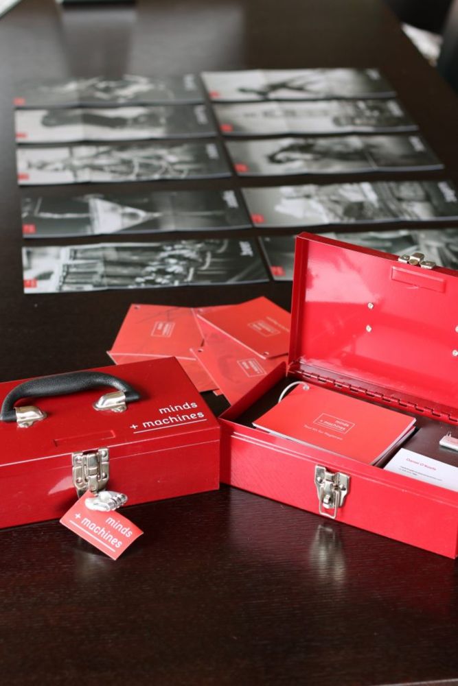 Minds + Machines red press kit box